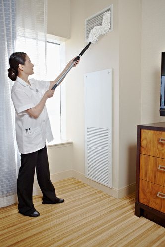 Woman cleaning ceiling vent