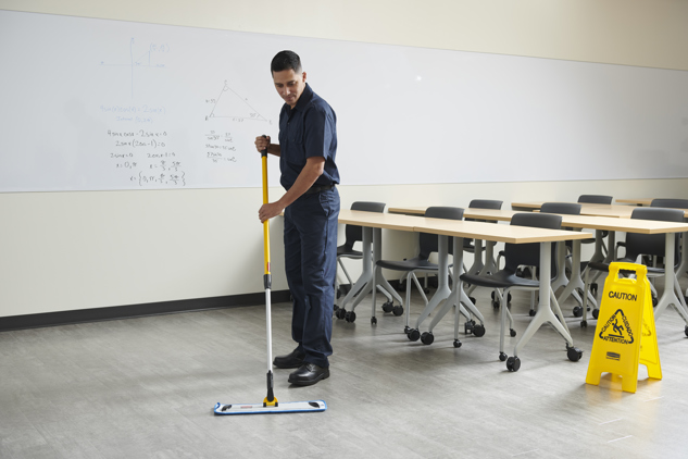 A staff mopping the floor